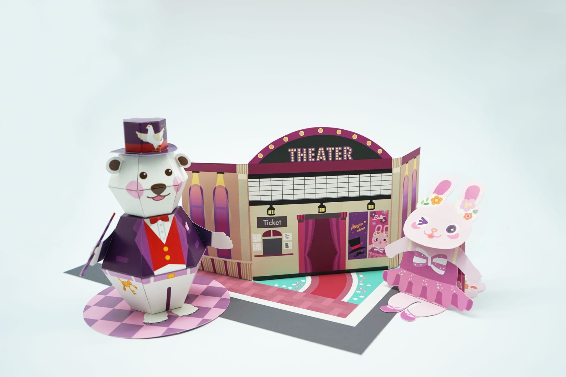 전구 간판이 빛나는 THEATER 극장 외관과 레드카펫을 배경으로 나란히 선 곰 마술사와 토끼 발레리나